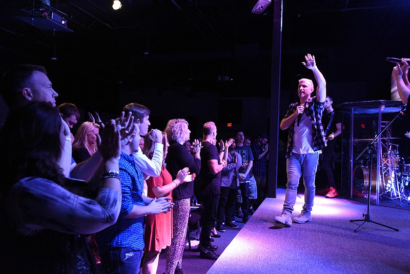 Pastor Tavner Smith leads a worship service at the Venue Church on Sunday, Oct. 25, 2015, in Chattanooga, Tenn.