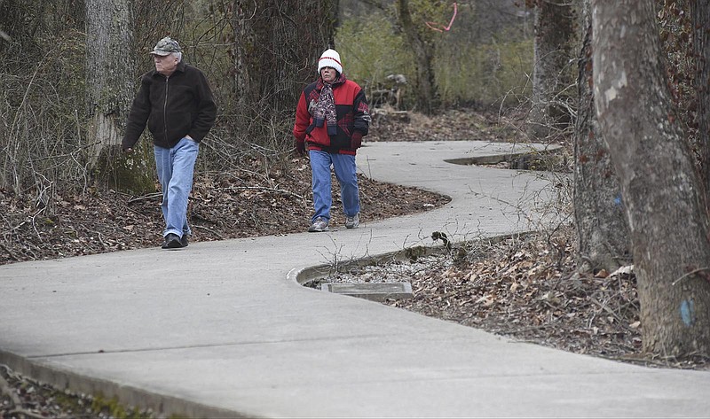Paula and Gary Tallant walk on the Wolftever Creek Greenway on Monday, Feb. 23, 2015, in Collegedale, Tenn. The pathway, nearly three miles long, connects Imagination Station and Veterans Park near Ooltewah-Ringgold Road with a park and playground near Southern Adventist University in Collegedale. 