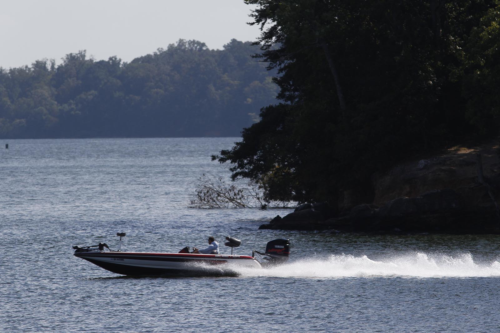 FYI
A fisherman motors through Chickamauga Lake in Lakesite, Tenn., on Friday.
