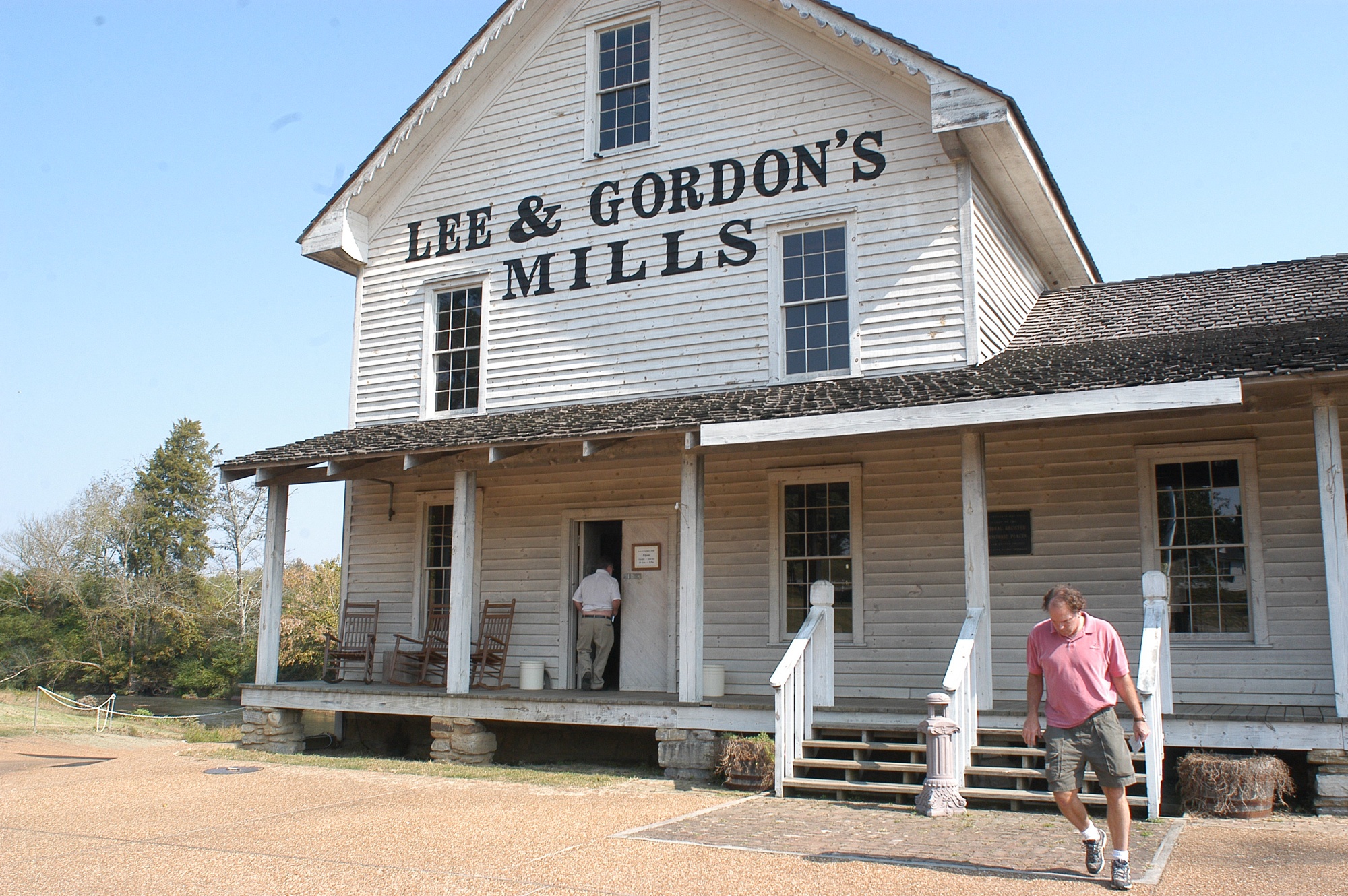 Dan Reynolds, of Chattanooga, right, exits the Lee and Gordon's Mills Wednesday afternoon in Chickamauga. The Mills will have a marker placed outside to designate it was one of several locations on the Heritage Trail in spring 2006.