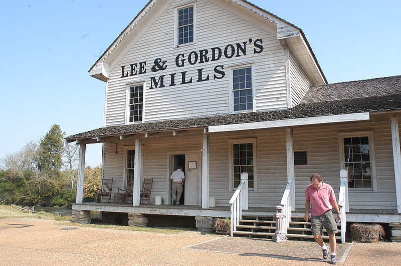 
Dan Reynolds, of Chattanooga, right, exits the Lee and Gordon's Mills Wednesday afternoon in Chickamauga.  The Mills will have a marker placed outside to designate it was one of several locations on the Heritage Trail in spring 2006.