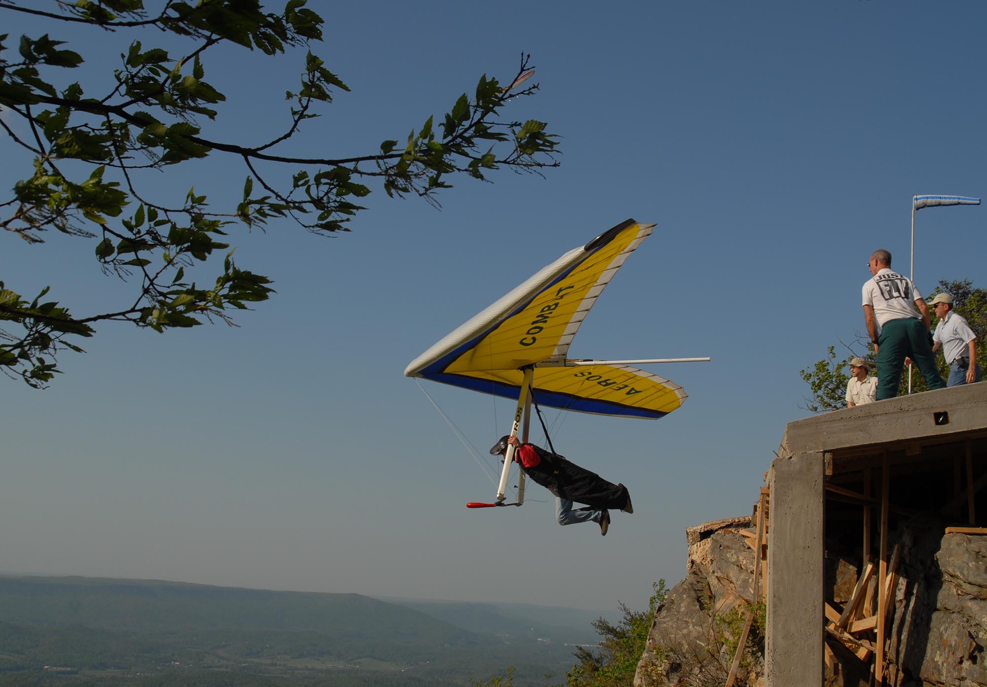 A hang glider launches from the Lookout Mountain Flight Park on Saturday afternoon where many gathered to fly or just watch. The park is planning on building a new ramp for the launch area.