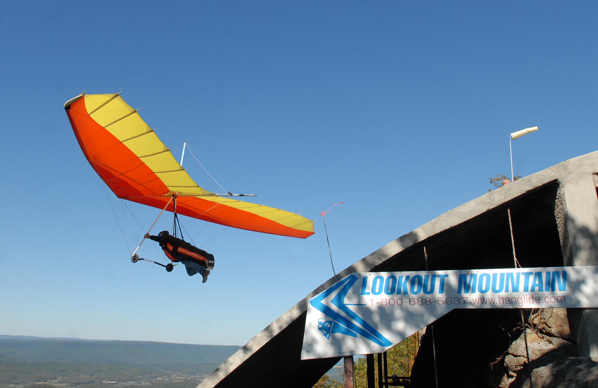 Chris Hooley of Cumming, Ga., takes off from the main launch site at Lookout Mountain Flight Park in Rising Fawn, Ga., on Saturday. Mr. Hooley has been hang gliding for about 10 years. The Flight Park will celebrate its 30th anniversary at the end of this month.