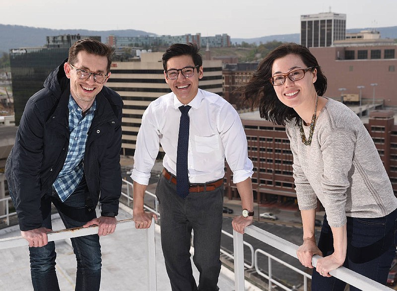 Joda Thongnopnua, center, David Morton, left, and Jackie Homann work at the Metro Ideas project, an independent nonprofit start up that is rethinking the traditional policy research model.