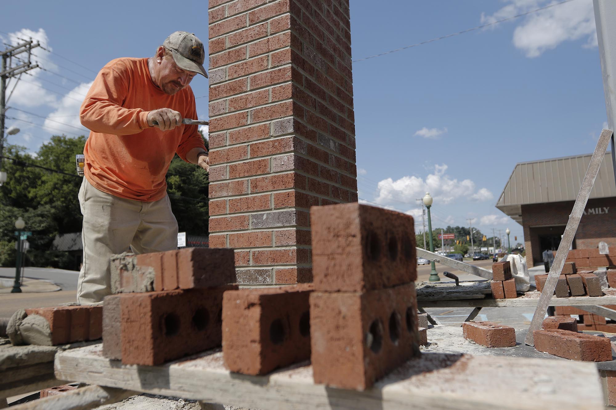 Dennis Welch, owner of Dennis Welch Masonry, Inc., construct a new sign for Red Bank Baptist Church on Thursday, Aug. 13, 2015, in Red Bank, Tenn. Welch says he expects the sign to be completed by next week.