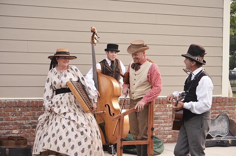 Members of a Civil War-style string band await their turn onstage at a previous DeKalb County Fiddlers Convention.