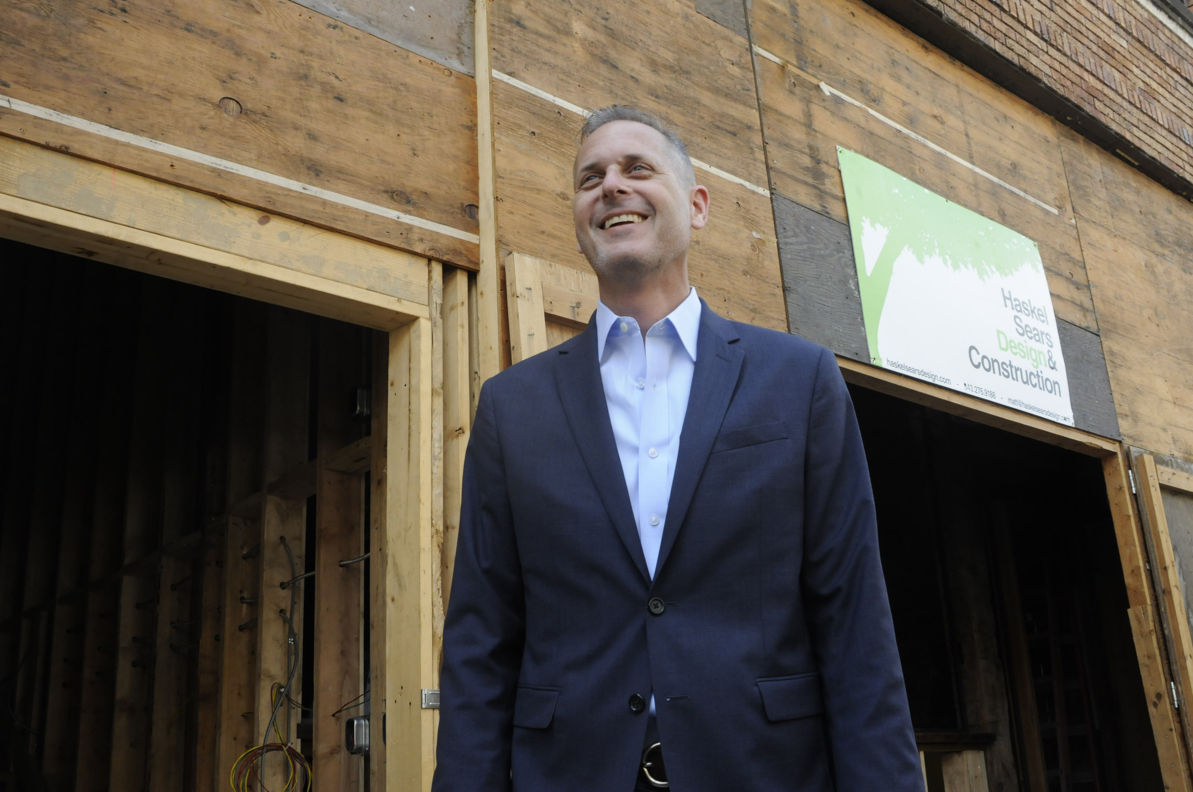 Christian Rushing talks about the new offices of his Chattanooga Design Studio amidst construction outside the former Cooper Office Supply on Cherry Street.