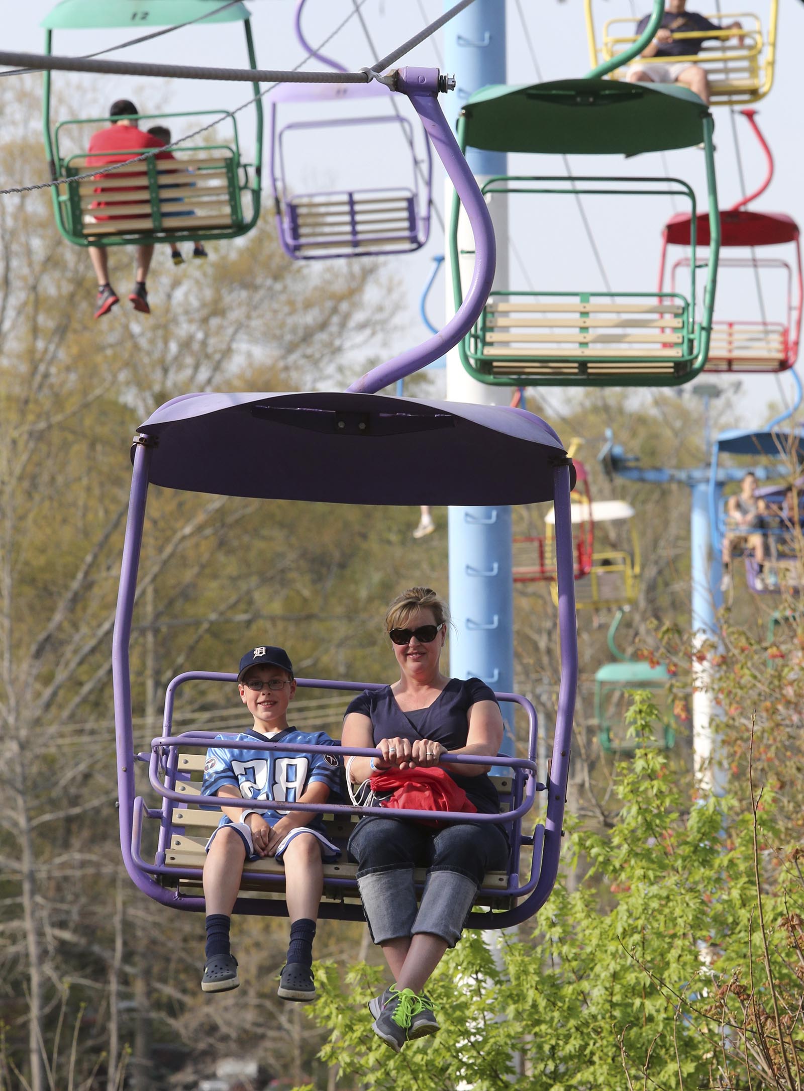 Grayson and Bridgett Officer ride the sky ride at Lake Winnepesaukah Amusement Park on Saturday, April 12, 2014, in Rossville, Ga. Saturday was opening day for the amusement park.