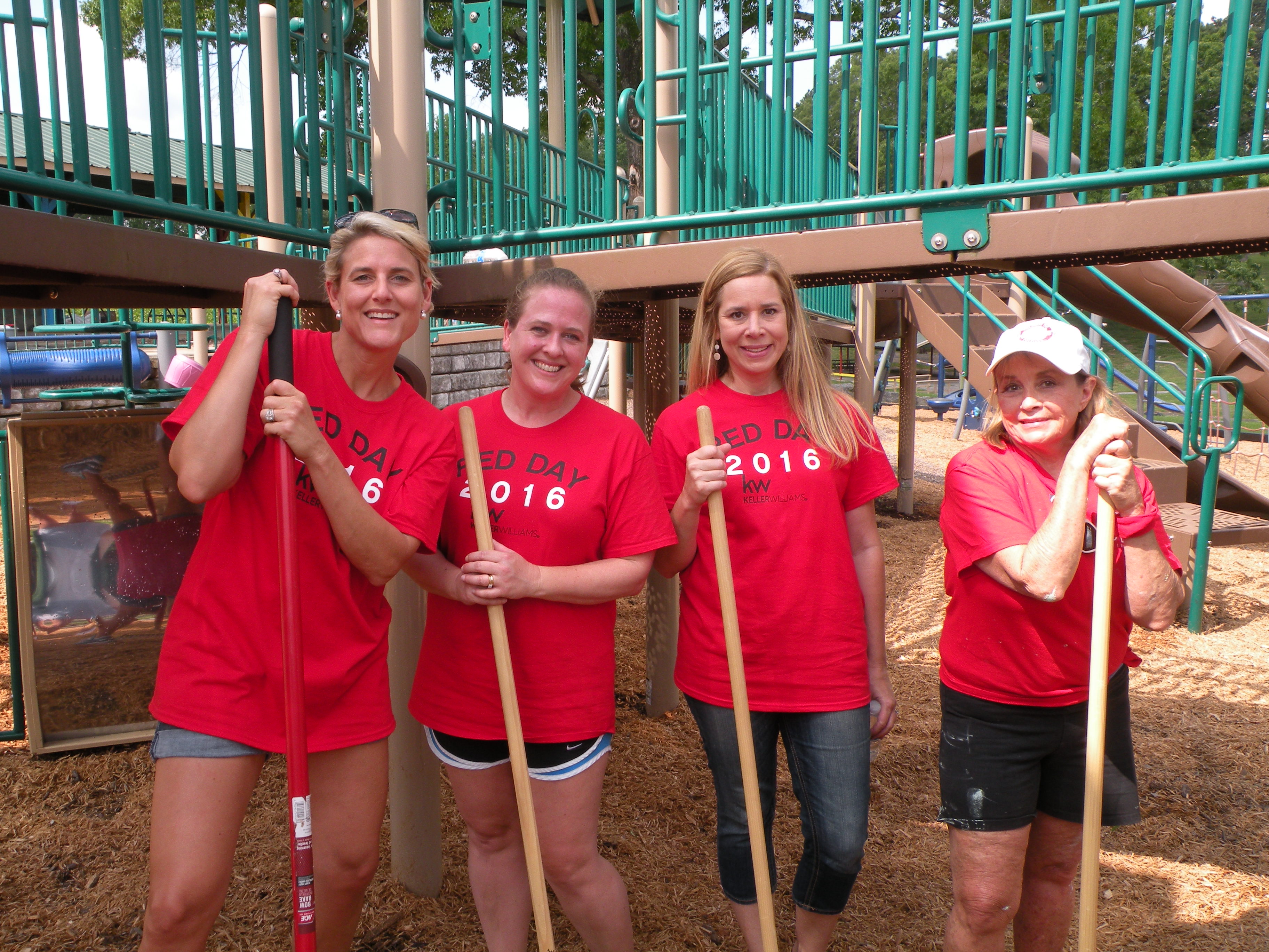 Ali Robinson, Stacey Barry, Kathy Robinson and Susan Swicegood, from left, spread new mulch onto the playground.