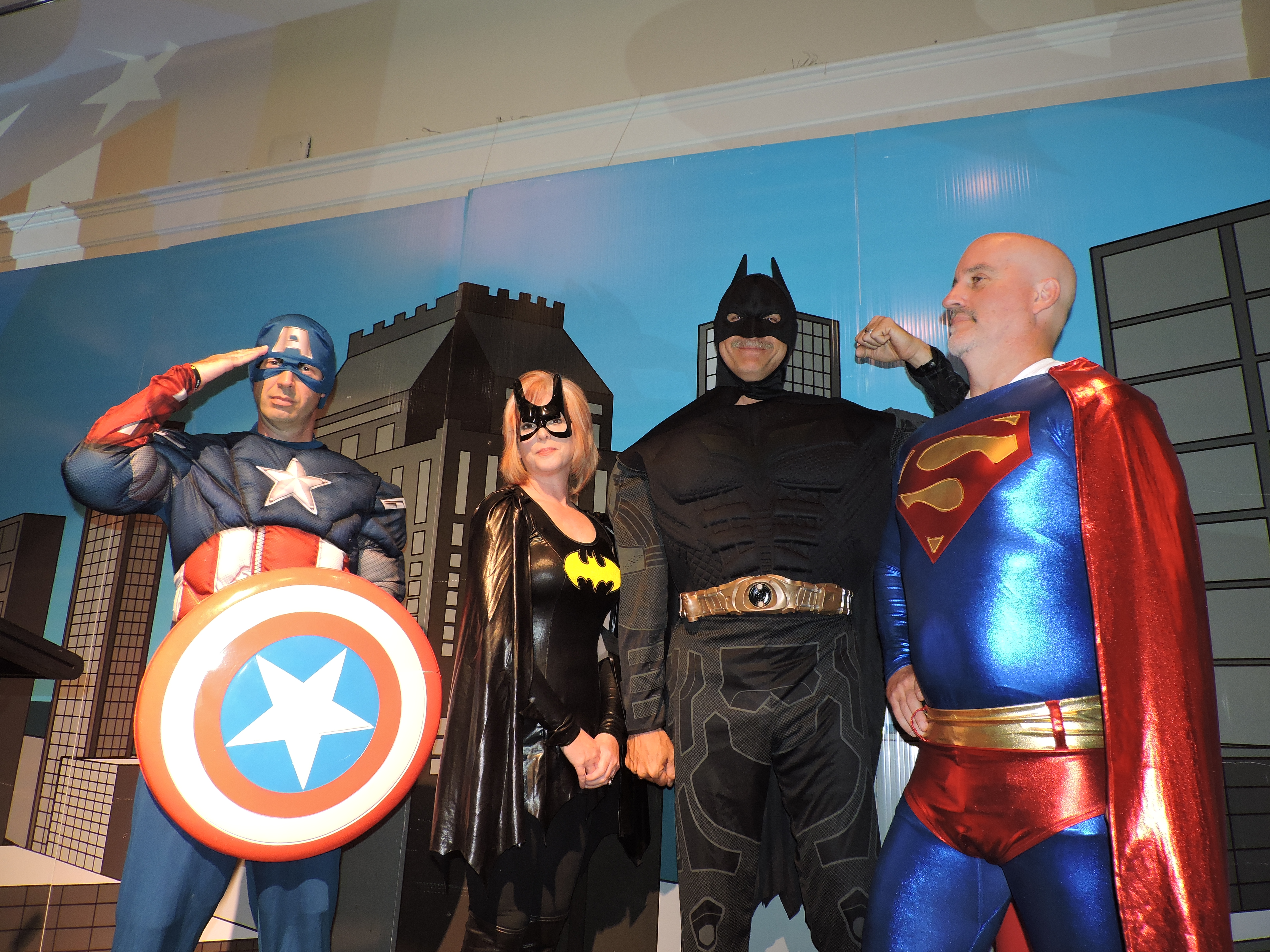 From left are Heritage Middle School Principal Chris Lusk as Captain America, Boynton Elementary School Principal Gina Haynes as Batgirl, Woodstation Elementary School Principal Ernie Ellis as Batman, and Battlefield Primary School Principal Geoff Rhodes as Superman.