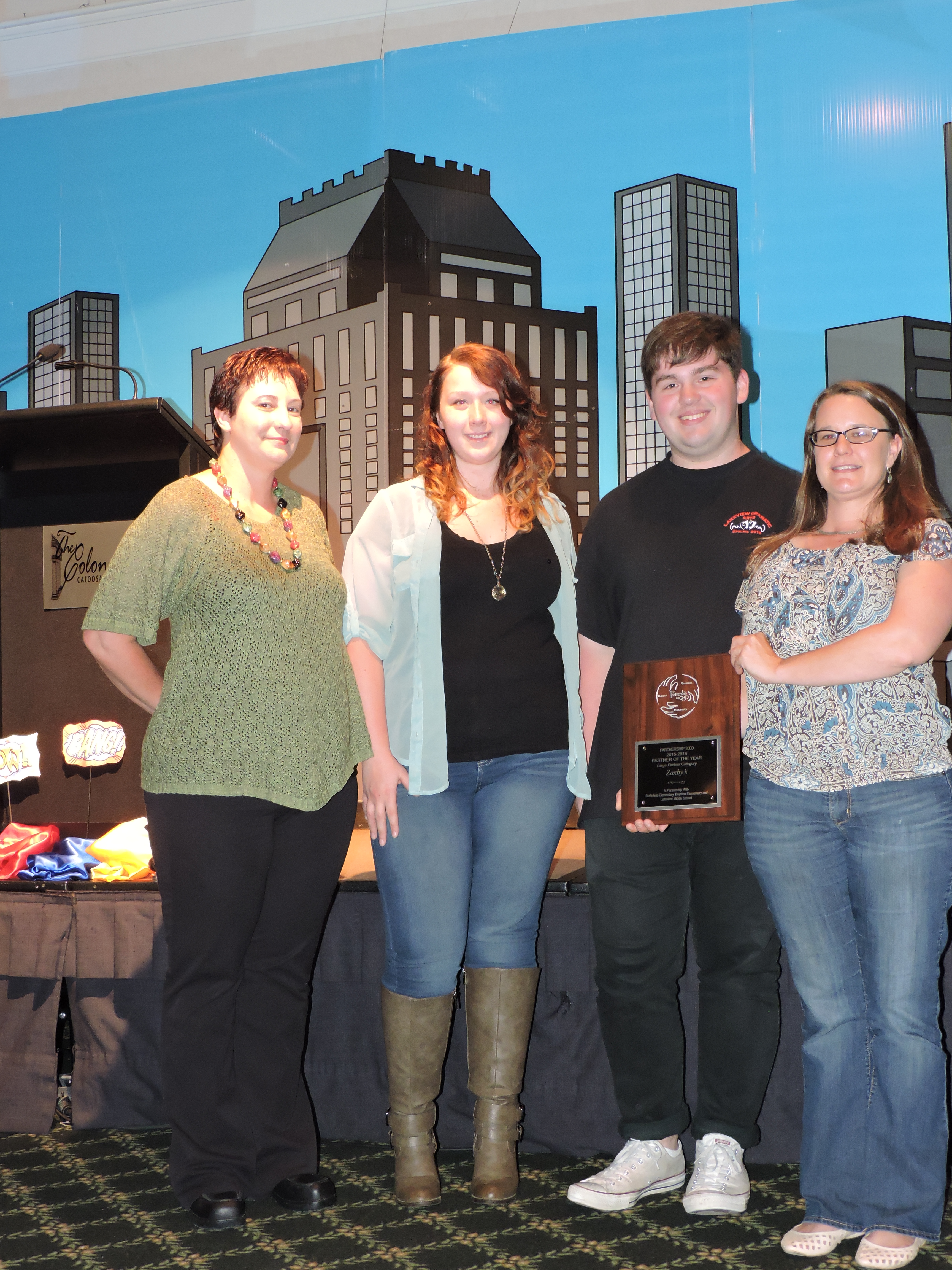 The Large Partner of the Year award goes to Zaxby's. Second from right is award presenter Nick Waters. Zaxby's hosted a Spirit Night fundraiser that raised $1,000 for Battlefield Elementary, and provided lunch for faculty chosen as Battlefield's Educator of the Month. Zaxby's also participated in Lakeview Middle School's Nine's Finest, which recognizes students for improvements, successes and accomplishments.