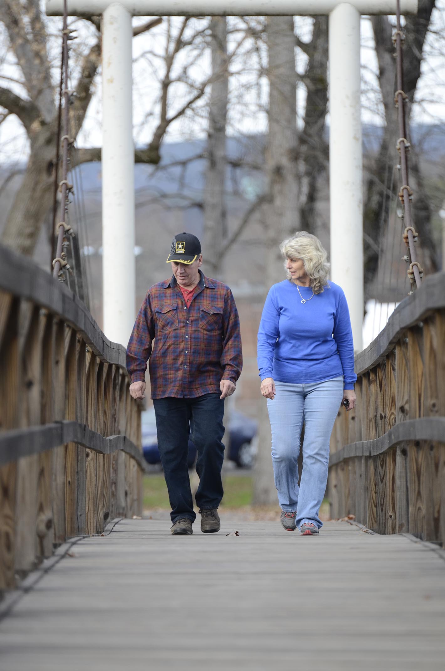 Dayton officials are planning to build a greenway trail that will connect Bryan College, Point Park and the downtown area with underpasses to cross beneath Highway 27 and Highway 30. Bill Coulter, left and his wife Connie take a walk over the bridge at Richland Creek Park in Dayton, Tenn., on Wednesday, December 3, 2014.