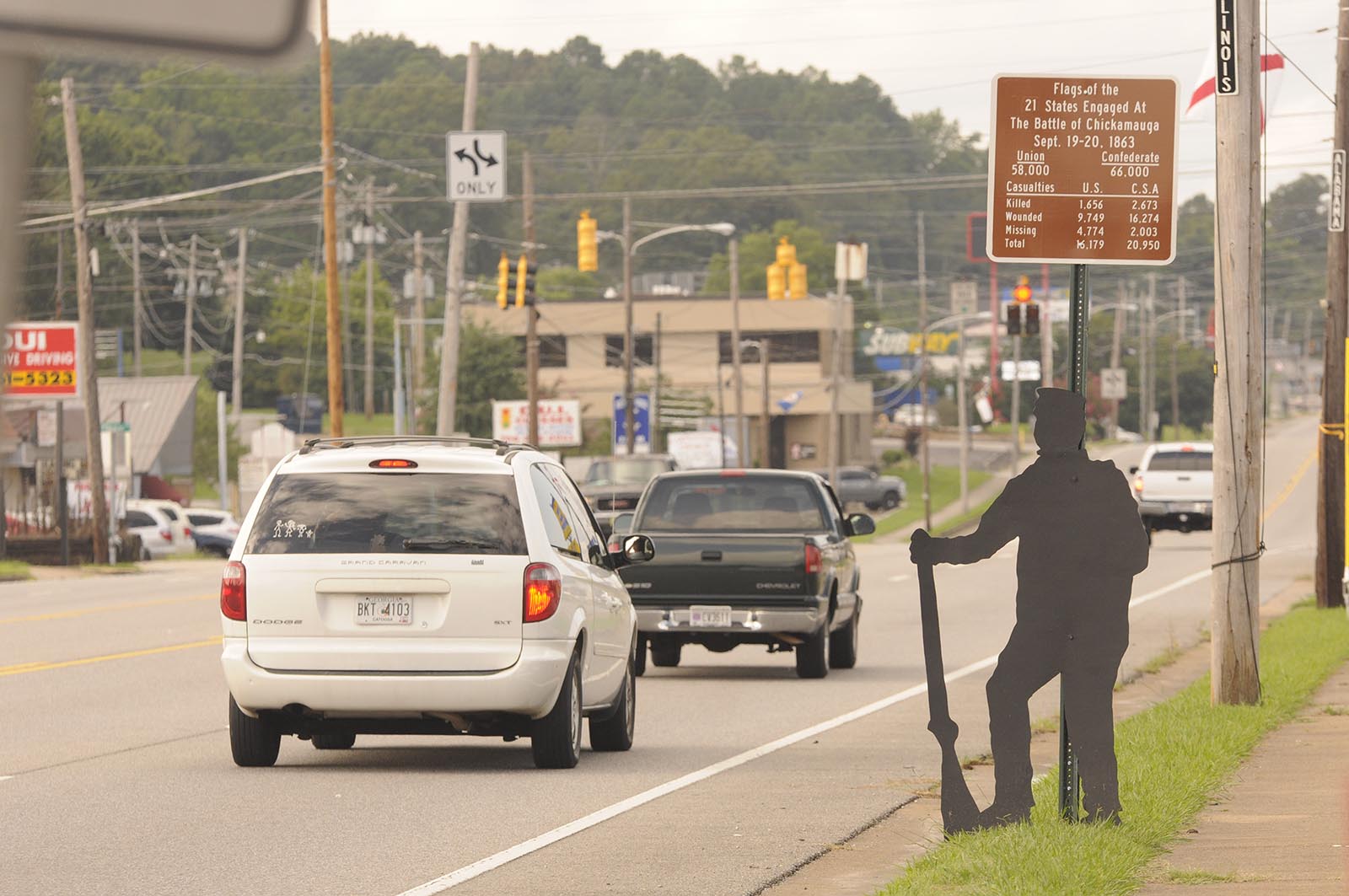 A wood figure stands along LaFayette Road in Fort Oglethorpe drawing interest to the upcoming 150th anniversary of the Civil War battles of Chattanooga and Chickamauga. Above the figure is a new sign that tells of the 21 states involved in the Battle at Chickamauga.