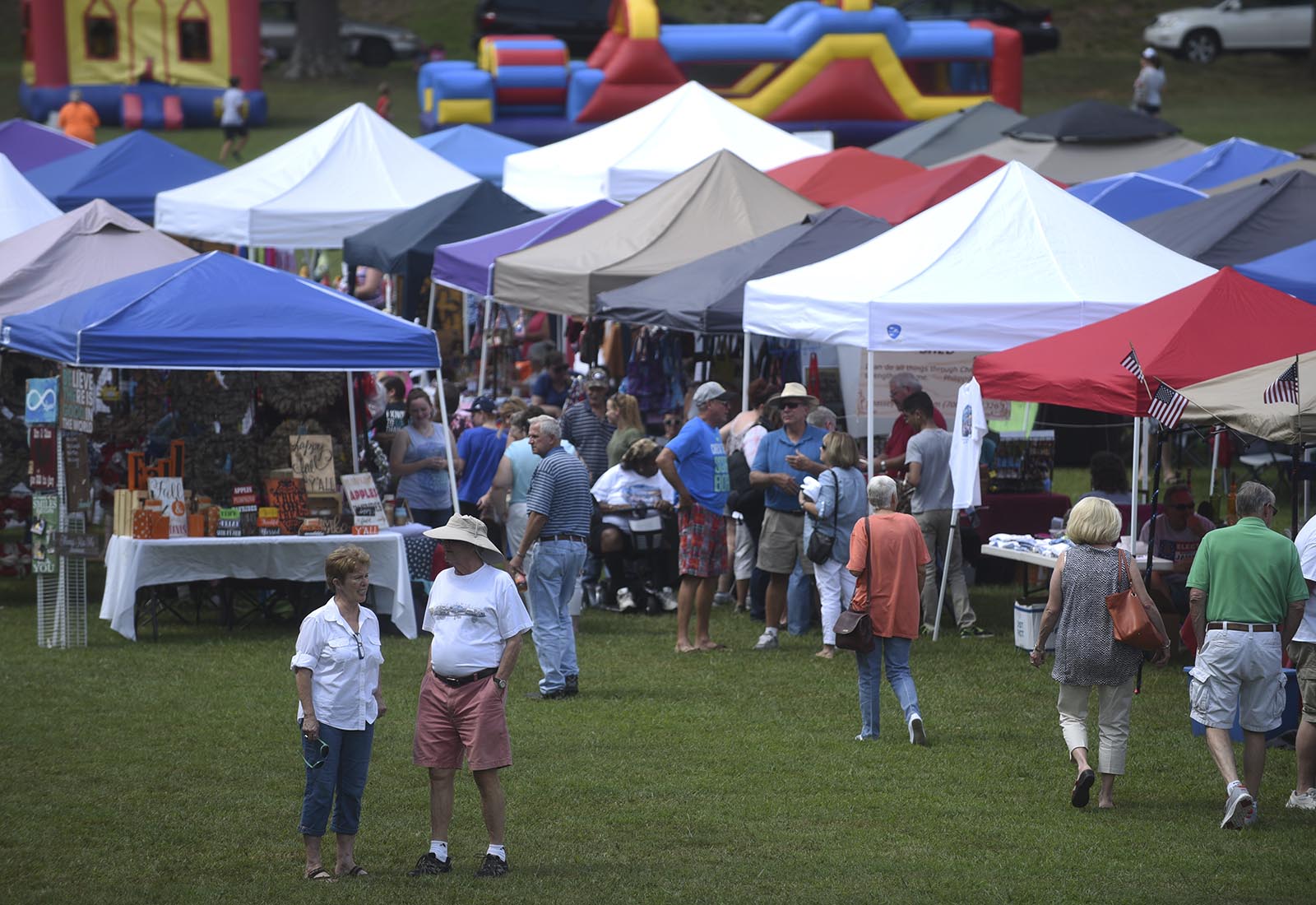 People walk among craft and vendor tents Monday, September 7, 2015 at Labor Day at the Post in Fort Oglethorpe, Ga.