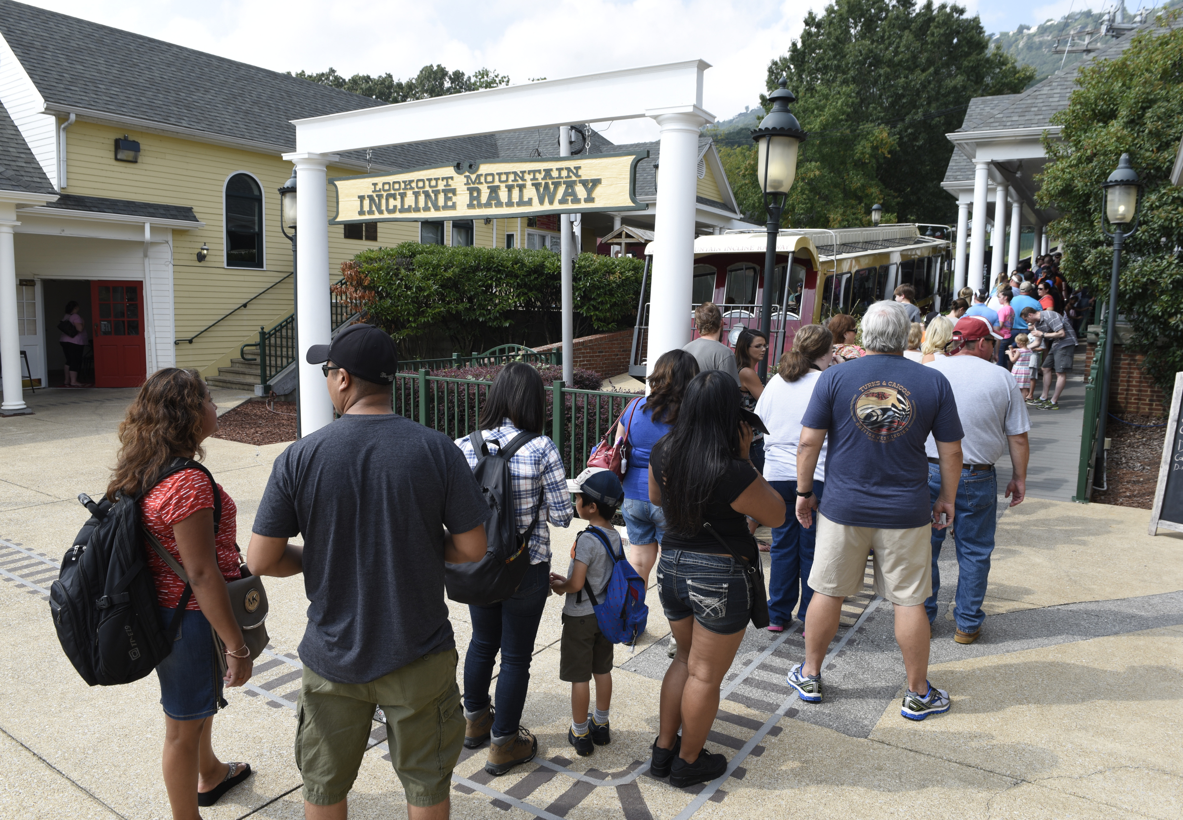 People stand in line at the St. Elmo station as they wait to board the Lookout Mountain Incline Railway on Sunday, Sept. 6, 2015, in Chattanooga, Tenn.