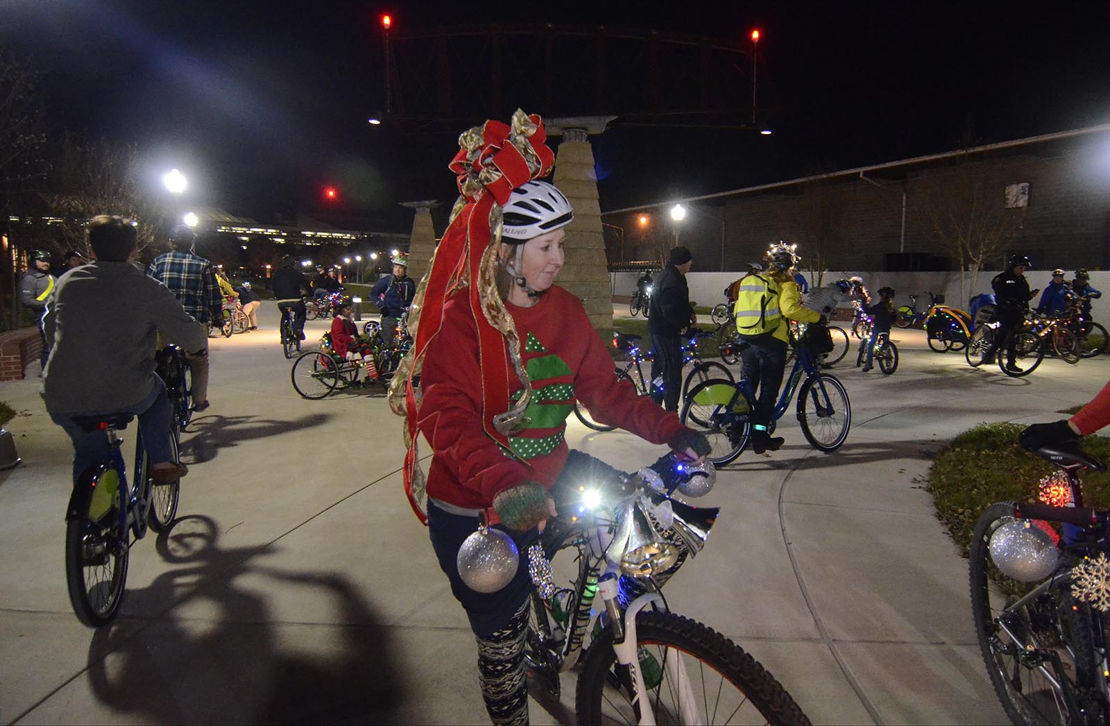 Kathryn Nash waits as the The Light Your Bike Family Bicycle Ride regroups in Main Terrain Art Park Friday evening. The ride was escorted by Outdoor Chattanooga, the Chattanooga Police Dept. and Green Trips Chattanooga.