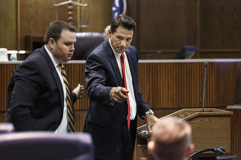 Defense attorney Bill Speek, right, directs defense attorney Jonathan Turner to play an audio recording on the second day of the murder trial of Billy Hawk in Judge Don Poole's courtroom in Hamilton County Criminal Court on Wednesday, June 1, 2016, in Chattanooga. A grand jury indicted Hawk, 62, in September for first-degree murder in the 1981 slaying of Johnny Mack Salyer.