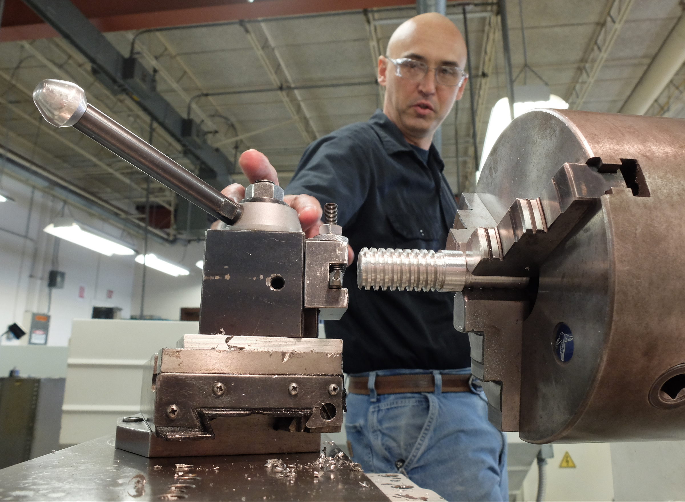 Wayne Denny, U.S. Army Retired, works at one of the lathe machines Monday afternoon in the Tennessee College of Applied Technology division at Chattanooga State.