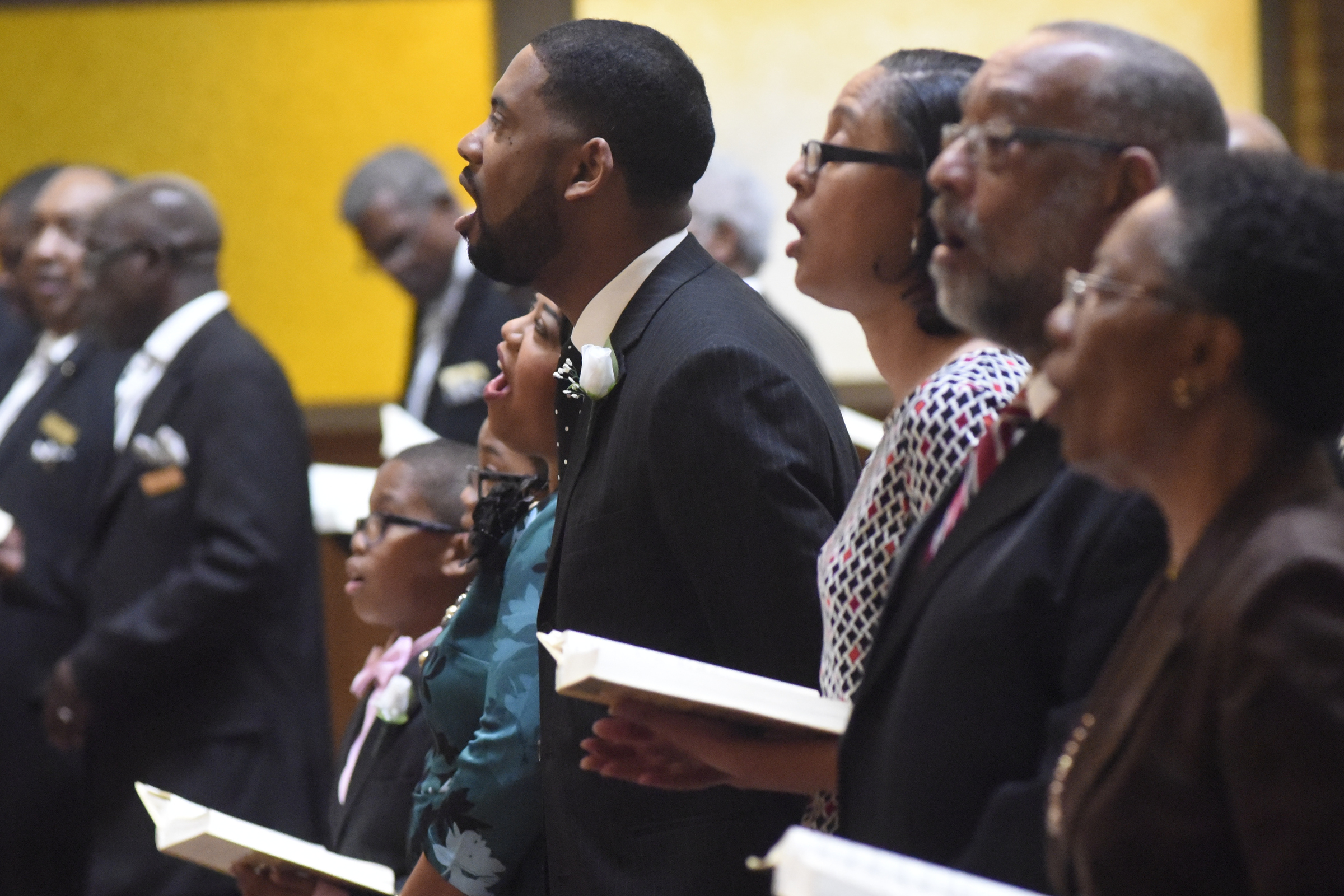 Rev. Dr. Ernest L. Reid, Jr., center, stands with his family and sings a hymn during a service where he was welcomed as the new pastor of the Second Missionary Baptist Church on Sunday, Oct. 18, 2015, in Chattanooga, Tenn. The church recently celebrated 149 years in operation and he is the 21st pastor in the church's history.
