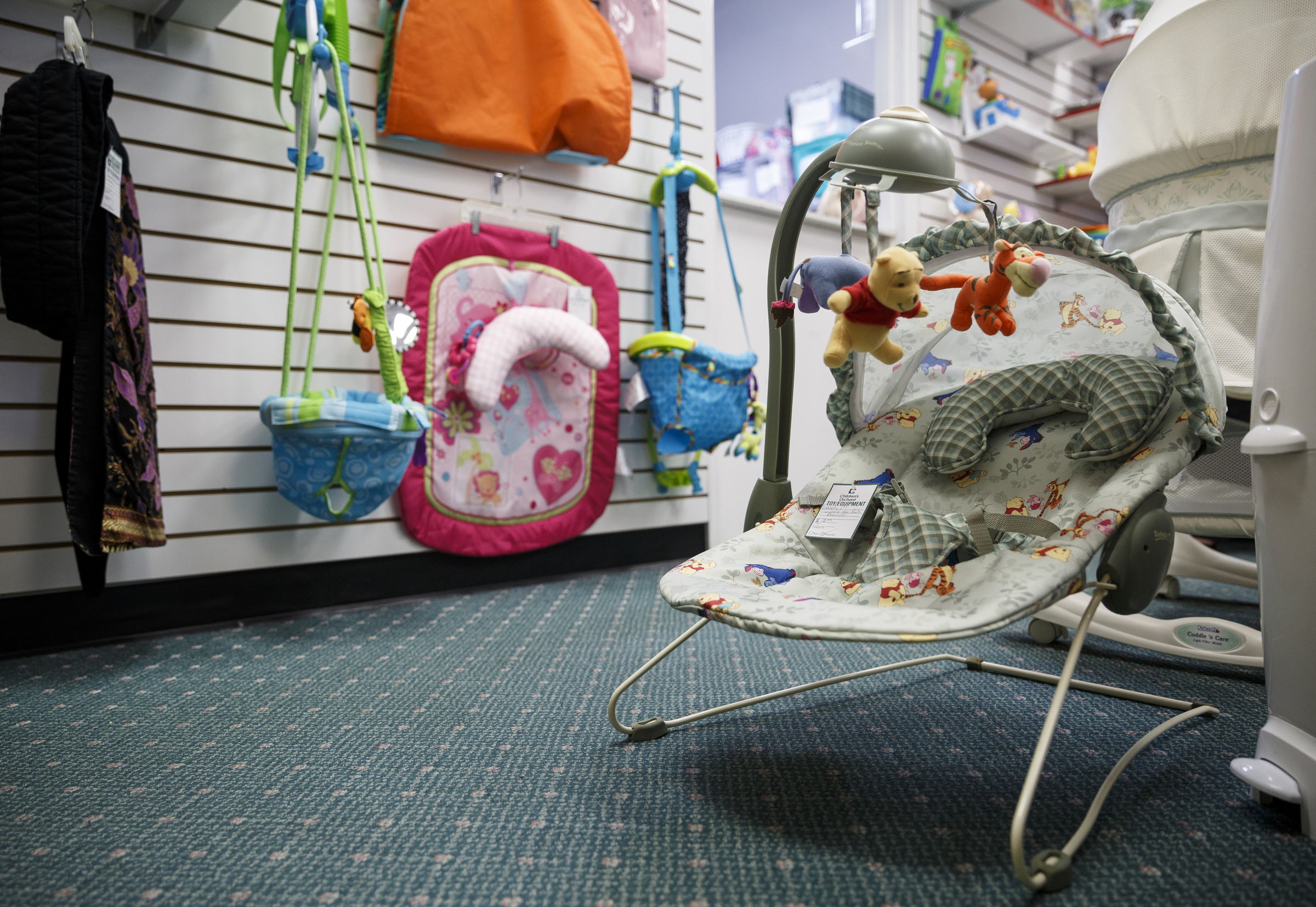 A child's seat is for sale at Children's Orchard clothing store on Thursday, June 2, 2016, in Cleveland, Tenn. The store sells used children's clothes, toys, and accessories brought in by customers.