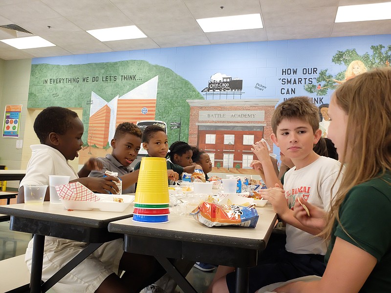 Battle Academy second grade students eat lunch in the downtown school cafeteria. Students from left are Joshua Bullis, Jeremy Daniels, Brandon Bryant, Trinity Williams, Aaliyah Smith, Rohan Woodruff and Kinsley Armstrong.