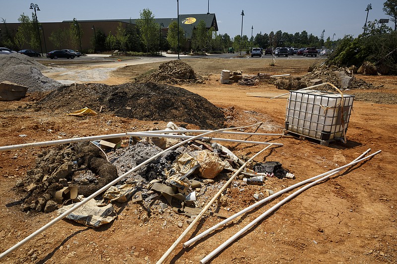 Equipment is set on a cleared site adjacent to the new Bass Pro Shops location on Camp Jordan Parkway on Wednesday, June 1, 2016, in East Ridge, Tenn. A sewer moratorium in East Ridge could prevent further planned development near Bass Pro Shops.