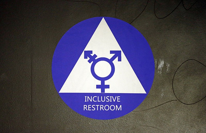 The Associated PressA new sticker designates a gender neutral bathroom at Nathan Hale High School in Seattle.