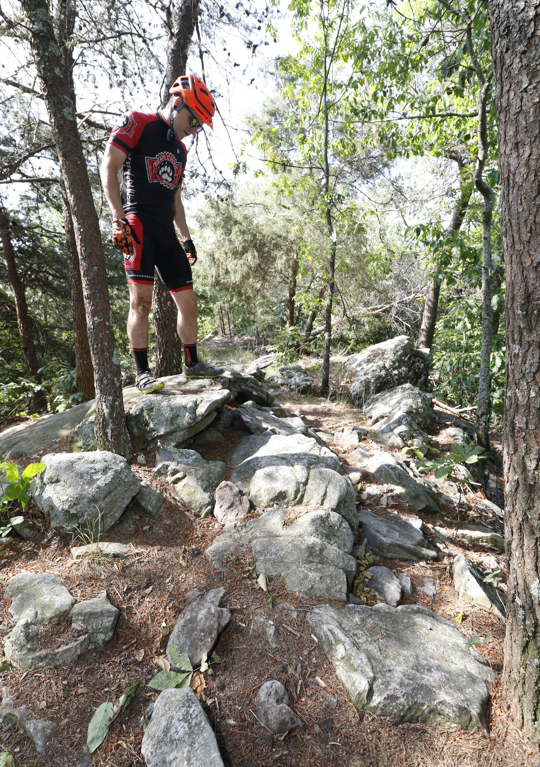 Staff Photo by Dan Henry / The Chattanooga Times Free Press- 5/25/16. Jeff Bartlett speaks about modifications with the removal or addition of rocks to make boulder garden sections easier to ride on an expert section of the Pinhoti Trail near the Dug Gap trailhead. With a small number of expert trails in the Chattanooga area these modifications are seen as destructive and bad for the mountain biking community as a whole.