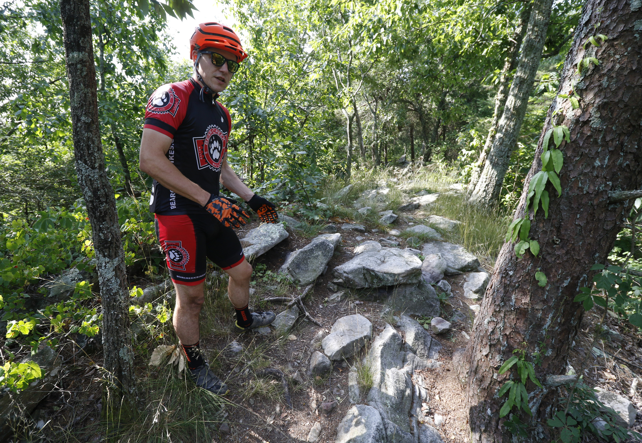 Staff Photo by Dan Henry / The Chattanooga Times Free Press- 5/25/16. Jeff Bartlett speaks about modifications with the removal or addition of rocks to make boulder garden sections easier to ride on an expert section of the Pinhoti Trail near the Dug Gap trailhead. With a small number of expert trails in the Chattanooga area these modifications are seen as destructive and bad for the mountain biking community as a whole.
