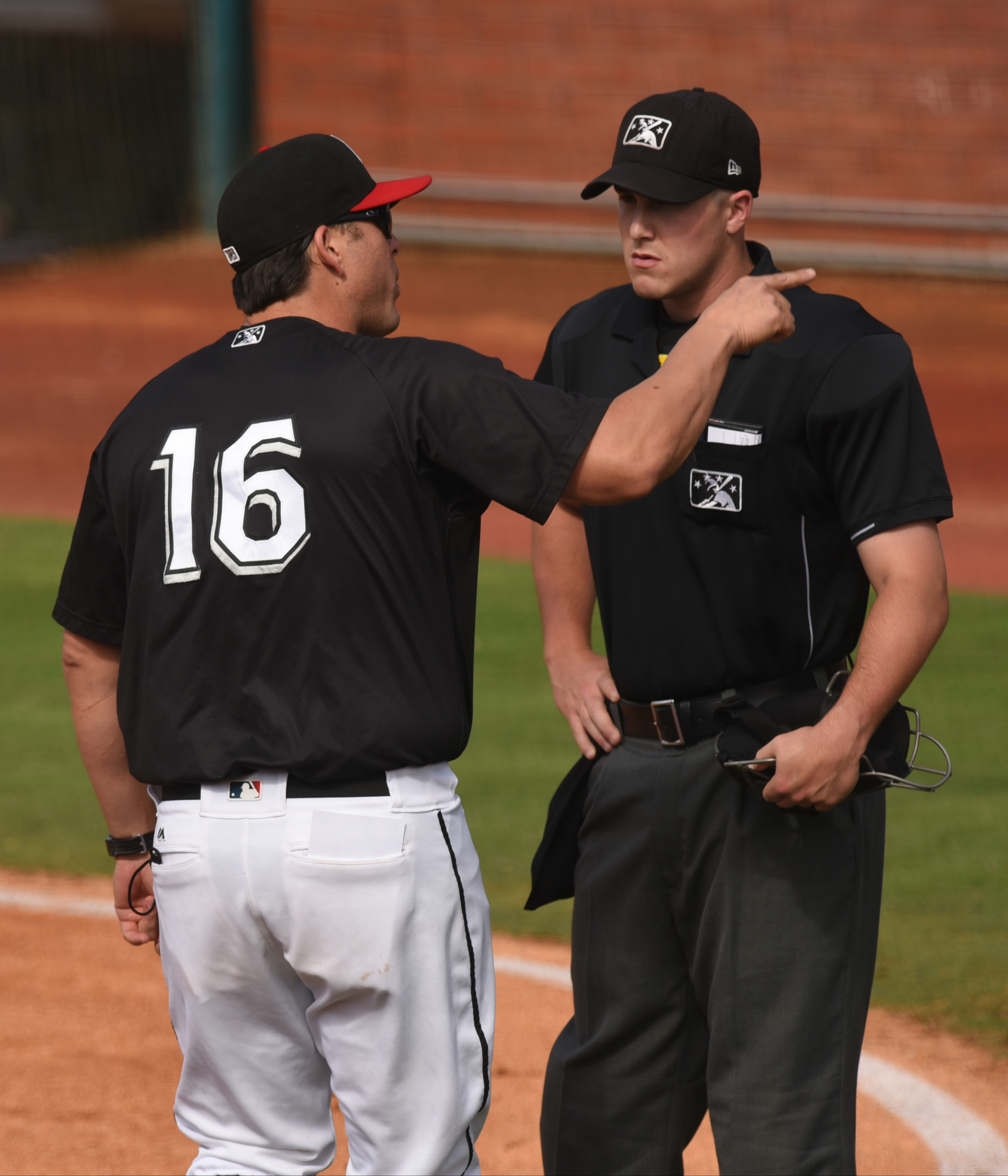 Chattanooga Lookouts manager Doug Mientkiewicz argues with an official during the game against the Jacksonville Suns Sunday, June 5, 2016 at AT&T Field.
