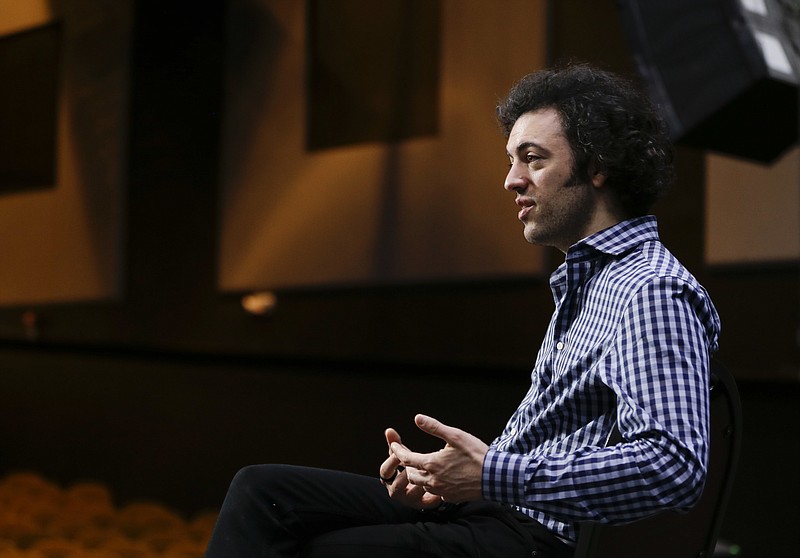 
              In this Friday, May 6, 2016 photo, Eric Jacobsen answers questions during an interview in Orlando, Fla. Beginning his second year as music director of the Orlando Philharmonic, Jacobsen is many things that modern classical music traditionally isn't: young, accessible and willing to be a tad goofy. (AP Photo/John Raoux)
            