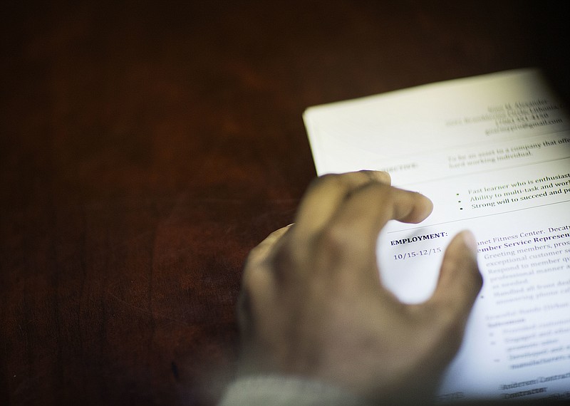 
              FILE - In this Thursday, March 3, 2016, file photo, a job candidate's resume sits on a table as he interviews for a job during a recruiting event at the Georgia Department of Labor office in Atlanta. Doubts deepened about the economy’s health on Friday, June 3, 2016, when the government reported that hiring slowed to a near-standstill in May. While unemployment slid from 5 percent to 4.7 percent, the lowest since November 2007, the rate fell for a troubling reason: Nearly a half-million jobless Americans stopped looking for work and so were no longer counted as unemployed. (AP Photo/David Goldman, File)
            