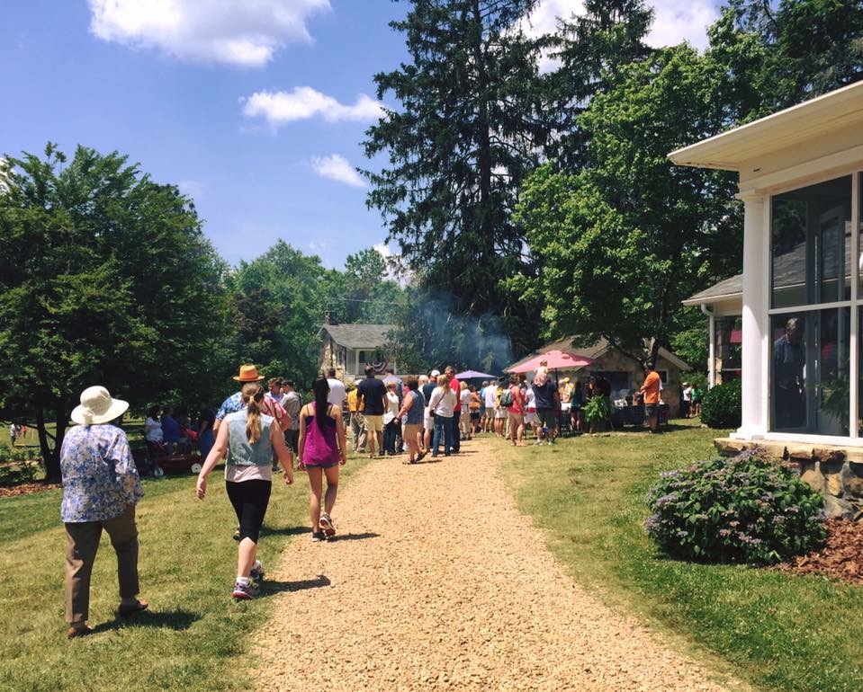 People pour into the the entrance of McCoy Farm for the Memorial Day event.