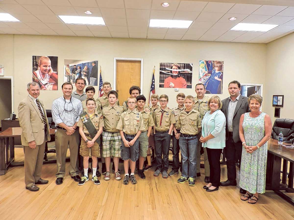Boy Scout Troop No. 3 of the Church of Jesus Christ of Latter-day Saints of Ooltewah-Ringgold Road visit the Catoosa County Board of Education's monthly meeting to complete a merit badge. The troop has 10 members from Ringgold. On the left is school board Chairman Don Dycus and to the right are members Gloria Hunt, David Moeller and Superintendent Denia Reese.
