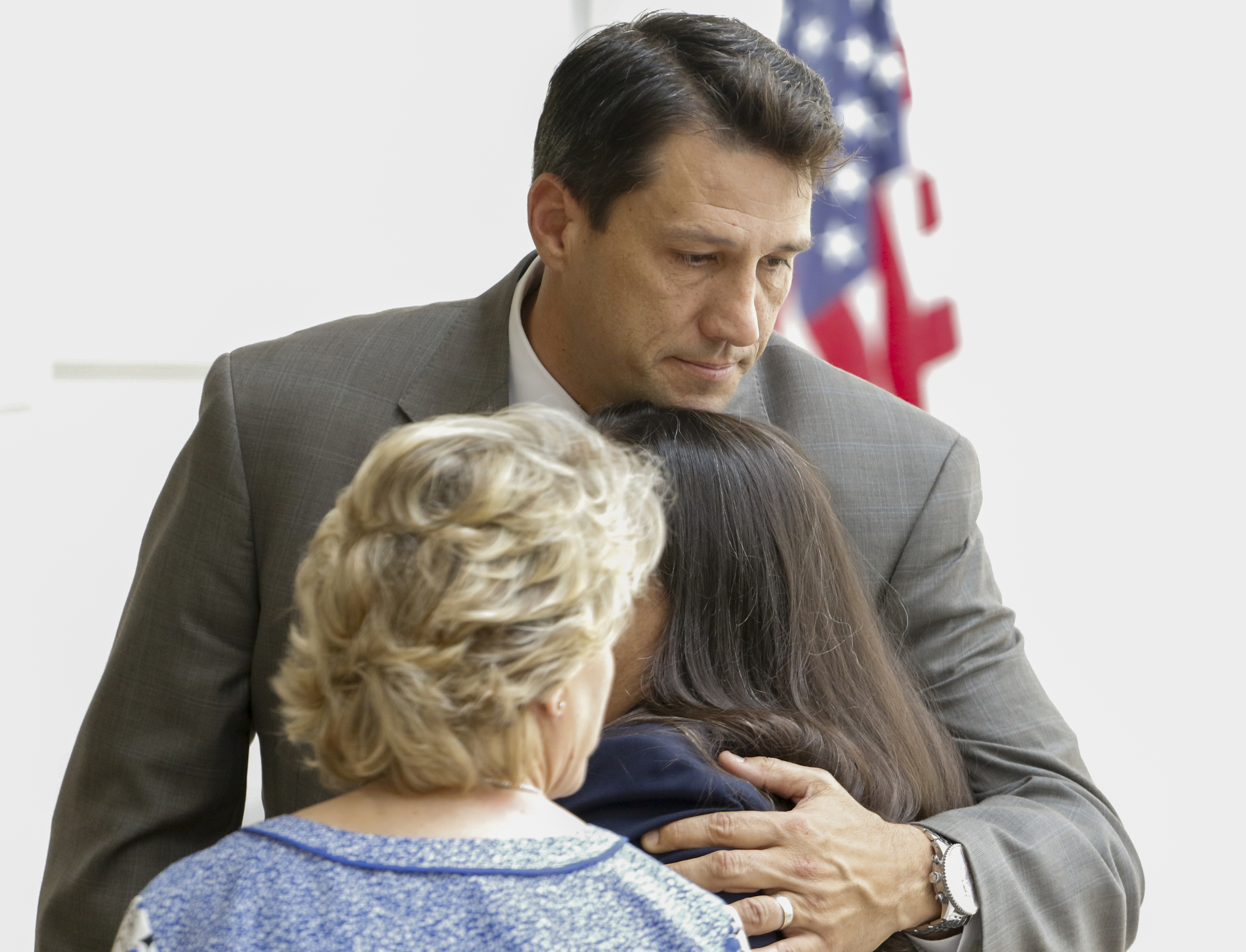 Staff Photo by Dan Henry / The Chattanooga Times Free Press- 5/25/16. Defense attorney Bill Speek hugs family members of Billy Hawk on Monday, June 6, 2016, moments after Hawk was found guilty of first degree murder and sentenced to life in prison for shooting, killing, and stuffing his co-defendant in a 1981 pending cocaine distribution case, Johnny Mack Salyer, in a 55-gallon steel drum.