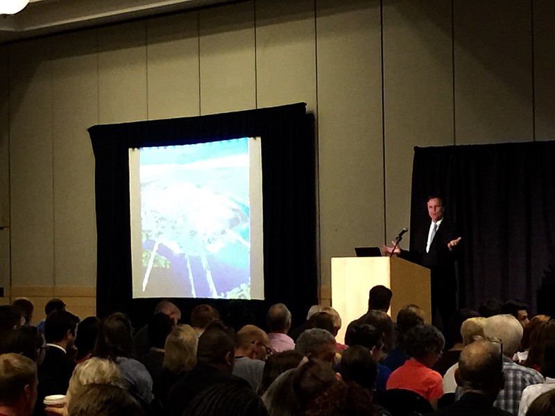 Bob Doak, president of the Chattanooga Area Convention and Visitors Bureau, addresses hundreds of tourism industry workers during a hospitality training session Monday at the Chattanooga convention center.