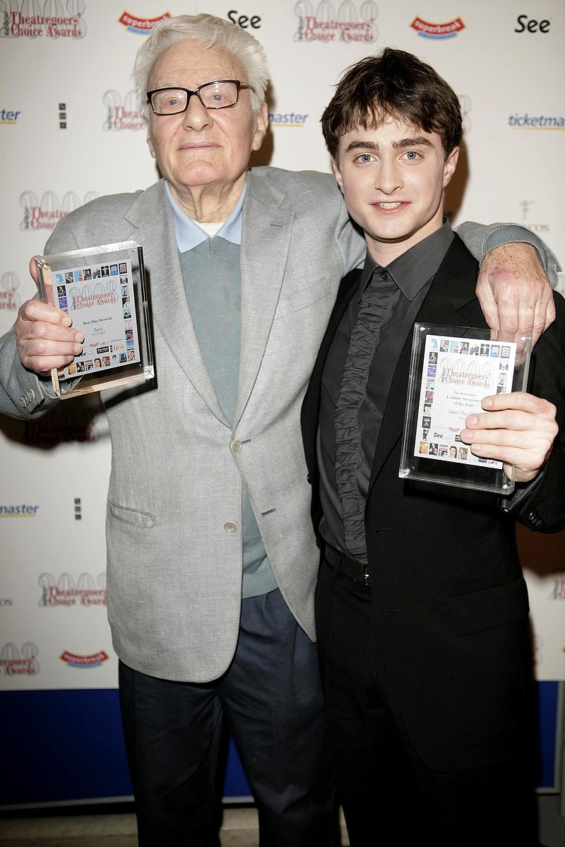 
              FILE - In this file photo dated Feb. 24, 2008, Sir Peter Shaffer stands with Daniel Radcliffe, right, as they celebrate being awarded by for Best Play Revival to Shaffer and Best Newcomer to Radcliffe.  The writer of Equus and Amadeus, Saffer has died at the age of 90 after a short illness, it is announced and confirmed by his agent Monday June 6, 2016. (Carmen Valino  / PA via AP) UNITED KINGDOM OUT - NO SALES - NO ARCHIVES
            