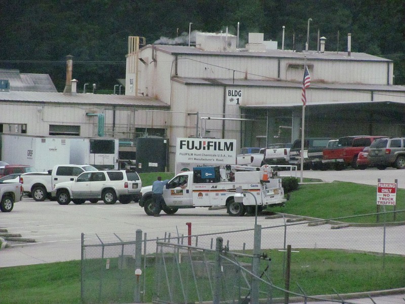 This 2011 file photo shows emergency workers gathering outside Fujifilm Hunt Chemical USA Inc. off Manufacturers Road in Dayton, TN , after a chemical spill.