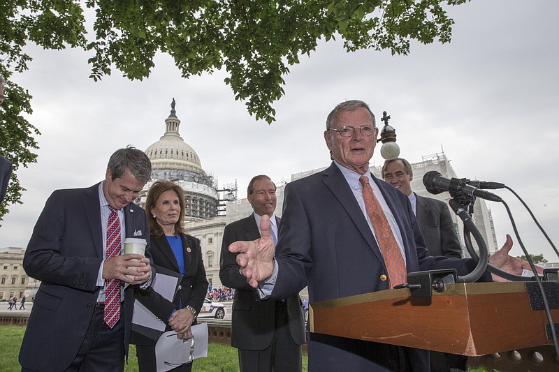 Senate Environment and Public Works Committee Chairman Sen. James Inhofe, R-Okla., joined by, from left, Sen. David Vitter, R-La., Bonnie Lautenberg, widow of the late New Jersey Sen. Frank Lautenberg, Sen. Tom Udall, D-N.M., and Sen. Jeff Merkley, D-Ore., discusses bipartisan legislation to improve the federal regulation of chemicals and toxic substances, Thursday May 19, 2016, during a news conference on Capitol Hill in Washington.