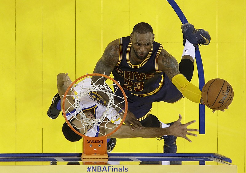 Cleveland Cavaliers forward LeBron James (23) shoots against Golden State Warriors guard Shaun Livingston during the first half of Game 2 of basketball's NBA Finals in Oakland, Calif., Sunday, June 5, 2016. (AP Photo/Marcio J. Sanchez, Pool)