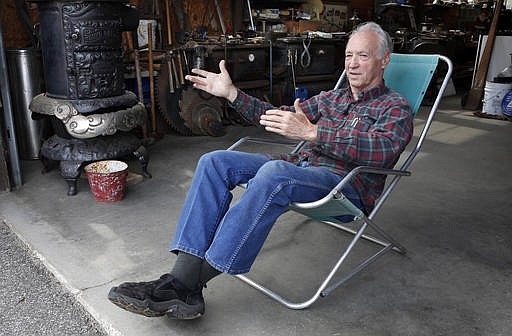 In this May 14, 2016 photo, wood stove and antique dealer Rodney Kimball speaks during an interview at his shop in West Bethel, Maine. "America is great but it could be a lot better if the politicians weren't fighting all the time like they are now," he said. (AP Photo/Robert F. Bukaty)