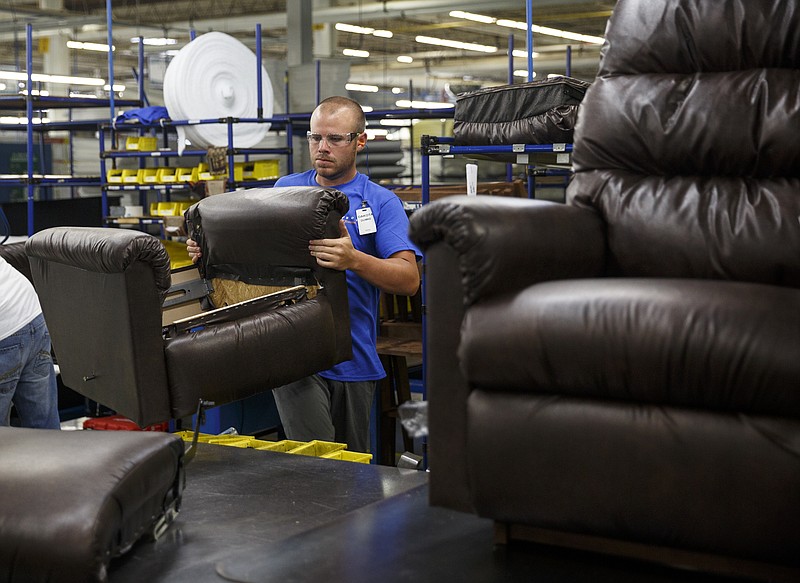 Dakota Dumke puts together a recliner at the La-Z-Boy furniture plant on Thursday, June 2, 2016, in Dayton, Tenn. The plant on Thursday marked 7 million hours without a lost work day case.