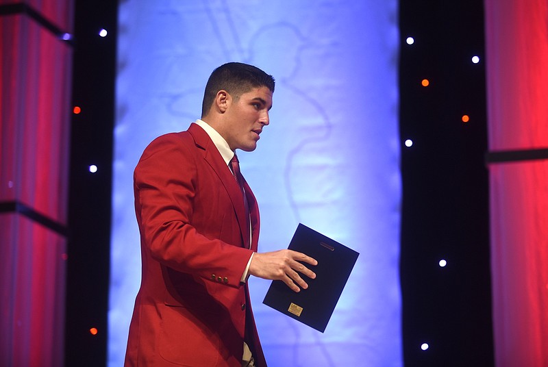 Baylor's Ryan Parker crosses the stage after receiving one of his awards at the Best of Preps banquet Thursday, June 9, 2016 at the Chattanooga Convention Center. Parker won three awards, including the Scrappy Moore male athlete of the year.