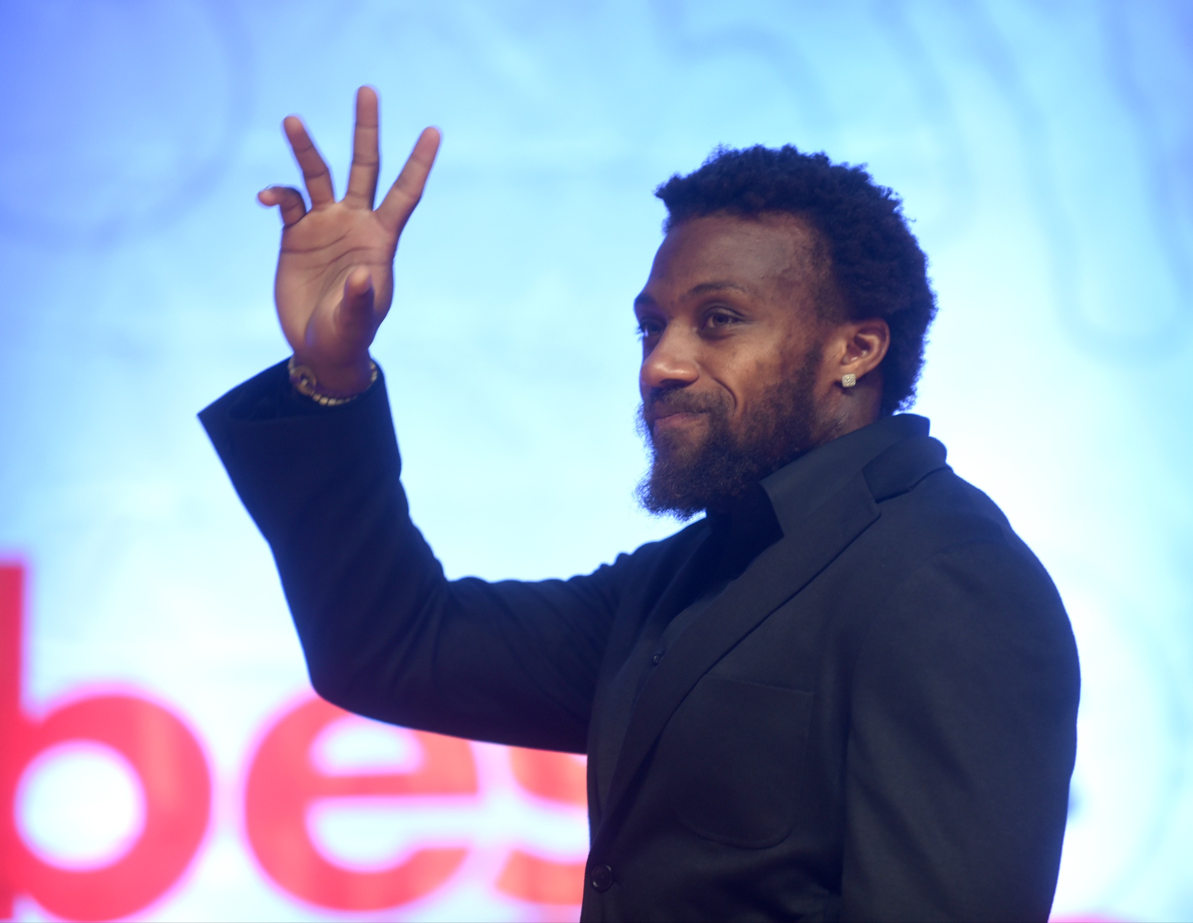 Eric Berry greets the crowd as he enters the stage at the Best of Preps banquet Thursday, June 9, 2016 at the Chattanooga Convention Center.