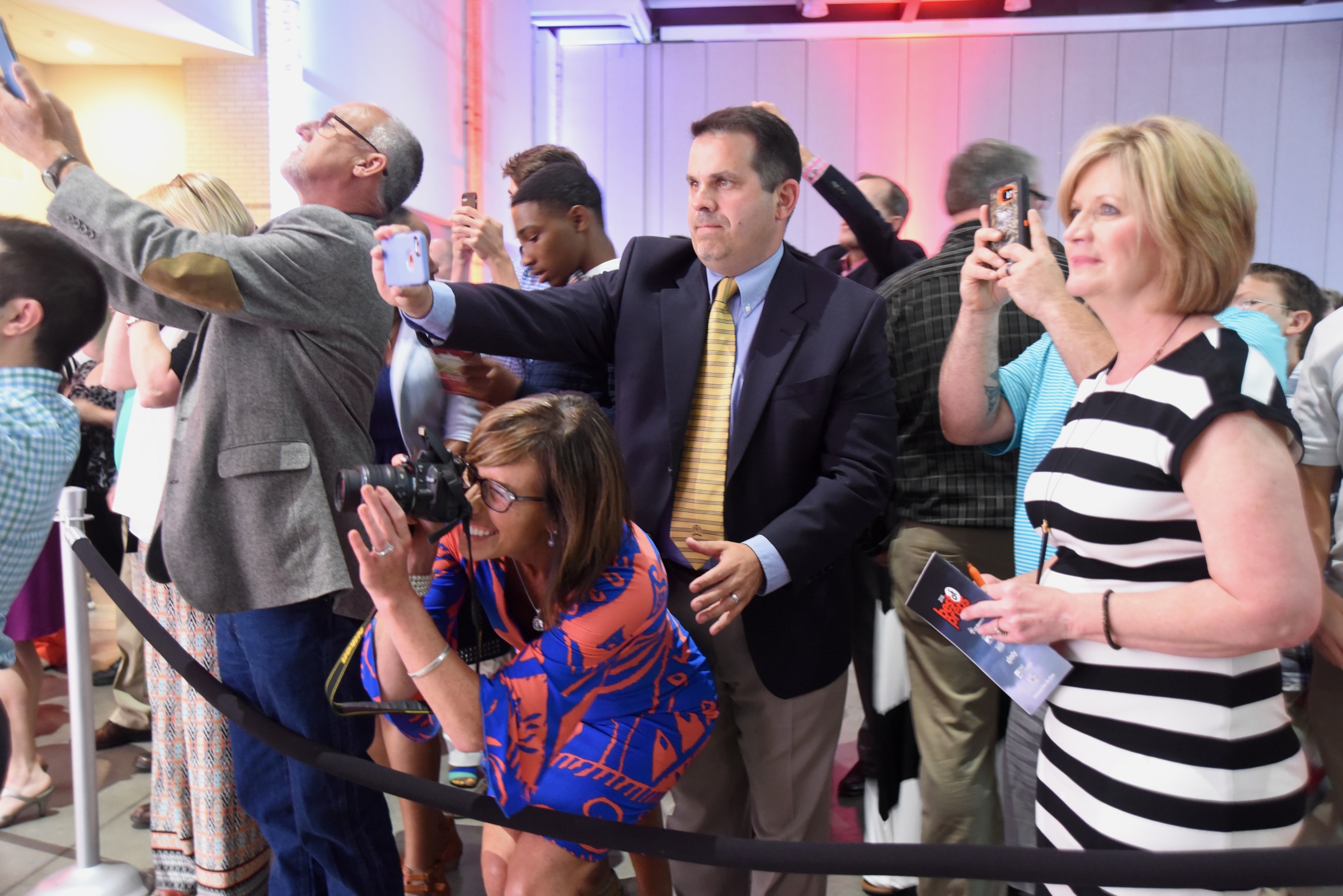 Parents and others take photos of award winners at the Best of Preps banquet Thursday, June 9, 2016 at the Chattanooga Convention Center.