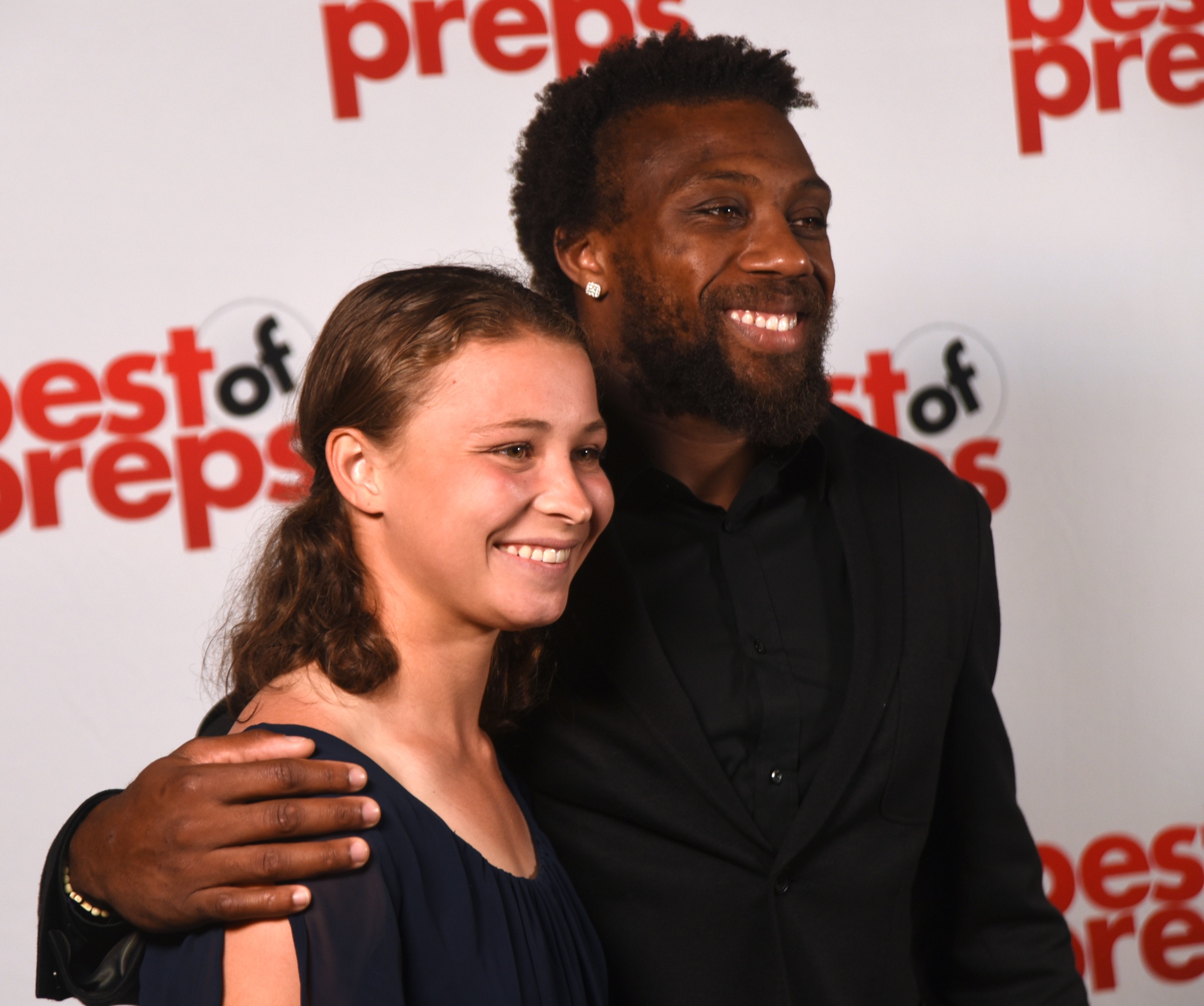 Signal Mountain's McKenzie Ethridge poses with former University of Tennessee standout Eric Berry at the Best of Preps banquet Thursday night at the Chattanooga Convention Center. Ethridge is the Scrappy Moore Girls' Athlete of the Year.