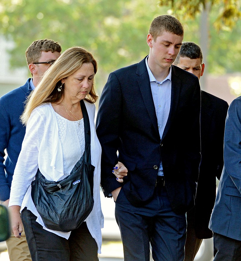 
              FILE - In this June 2, 2016 file photo, Brock Turner, right, makes his way into the Santa Clara Superior Courthouse in Palo Alto, Calif. Some parents are using the unusual publicity surrounding the sentencing of the student-athlete, Turner, at Stanford to talk to their own children about sexual misconduct, binge drinking, personal responsibility and other tough topics, supplementing their own thoughts with the powerful words of the victim in the case. (Dan Honda/San Jose Mercury News via AP, File)  MAGS OUT; NO SALES; MANDATORY CREDIT
            