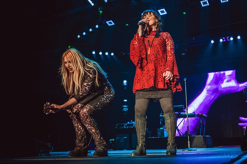 Seattle-based hard rock legend Heart was formed in the early 1970s by sisters Nancy, left, and Ann Wilson. The band will perform tonight as the headliner of the Riverbend festival.