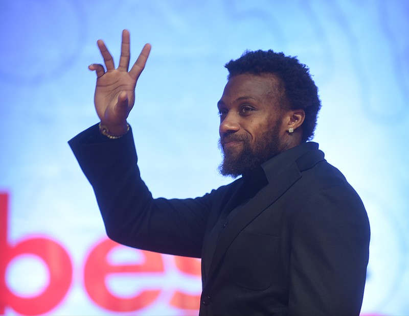 Eric Berry greets the crowd as he enters the stage at the Times Free Press Best of Preps banquet on Thursday at the Chattanooga Conqvention Center.