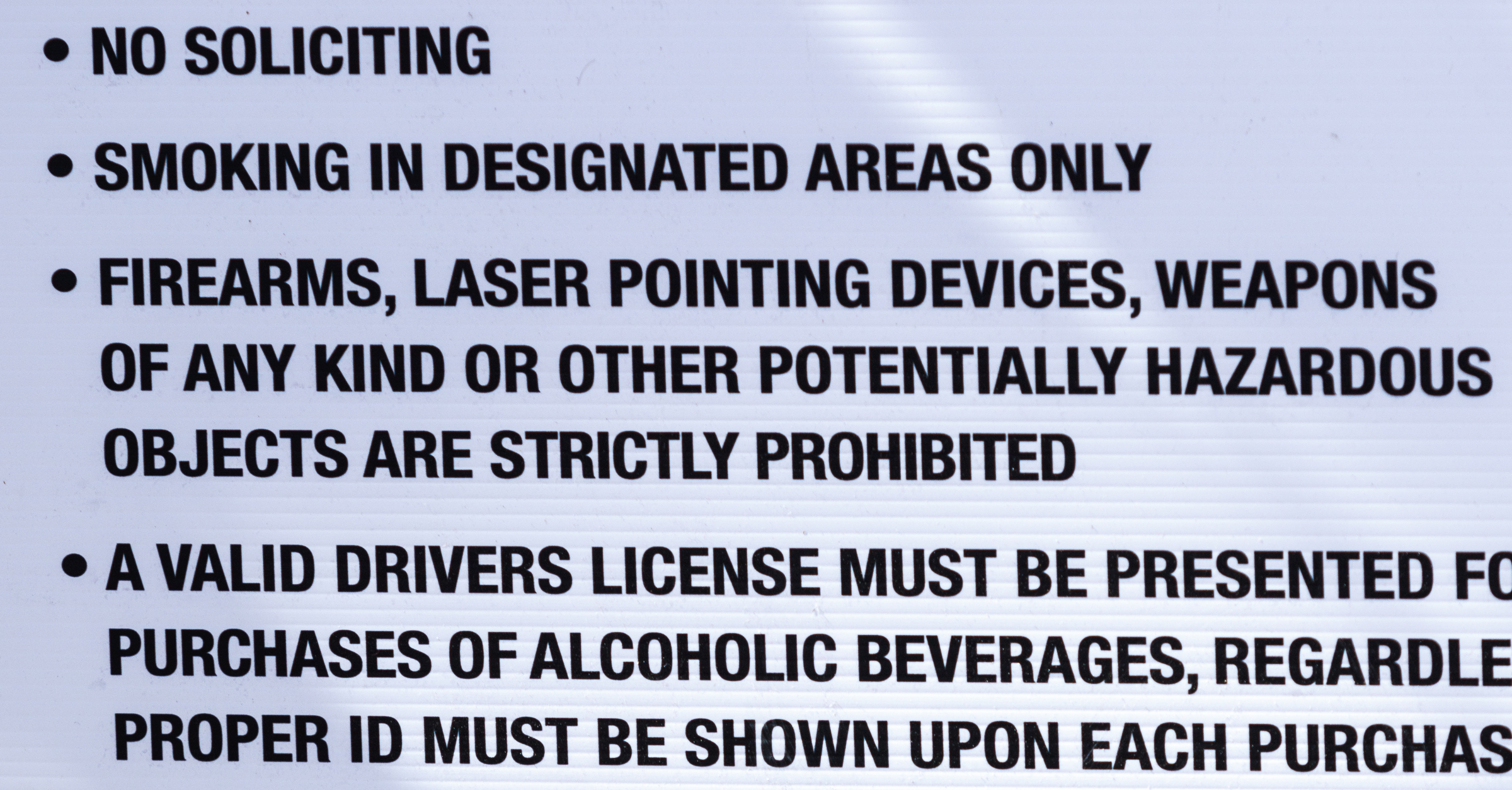 A sign at the festival entrance indicates that firearms are prohibited on the 1st day of the Riverbend Festival at Ross's Landing on Friday, June 10, 2016, in Chattanooga, Tenn. The festival is celebrating its 35th year, and Thomas Rhett was Friday night's headlining act.